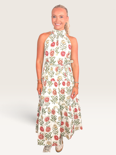 Tucker Brown sleeveless maxi dress in white with a vibrant red and green zinnia floral print and high halter neckline