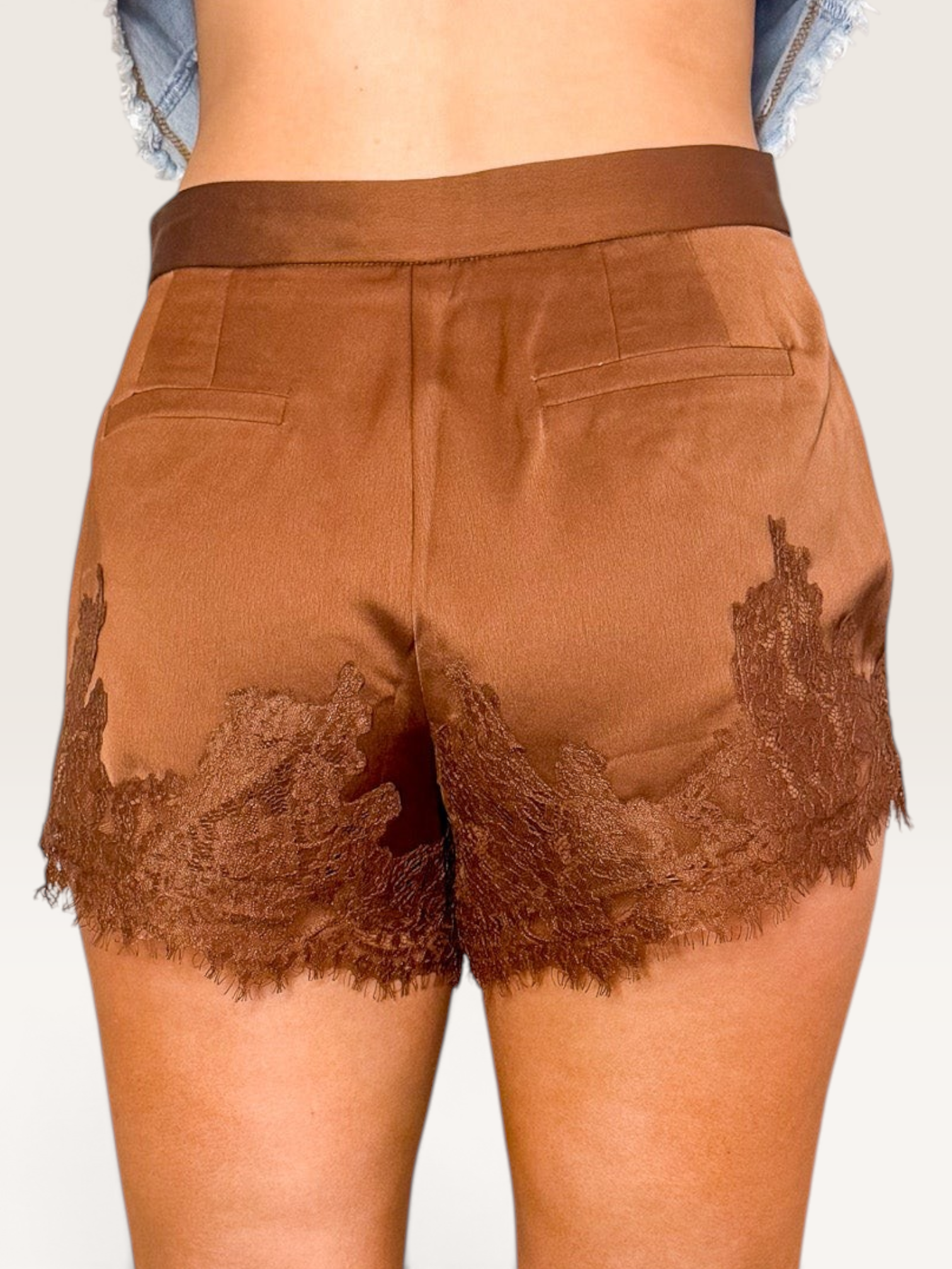 Tucker Brown brown satin shorts with floral eyelash lace trim and scalloped hem worn with cream cowboy boots
